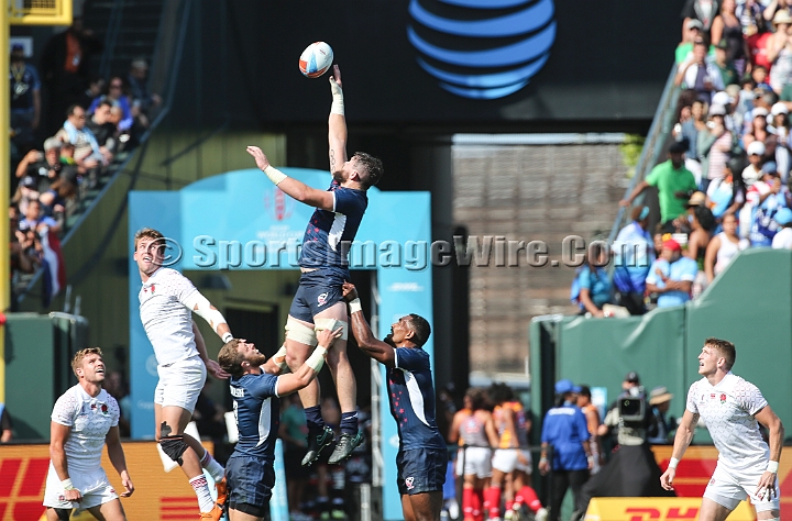 2018RugbySevensSat-32.JPG - United States player Danny Barrett (3) handles the throw in against England in the men's championship quarter finals of the 2018 Rugby World Cup Sevens, Saturday, July 21, 2018, at AT&T Park, San Francisco. England defeated USA 24-19 in sudden death play. (Spencer Allen/IOS via AP)